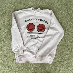 Urban sophistication smiley cosmetics crewneck